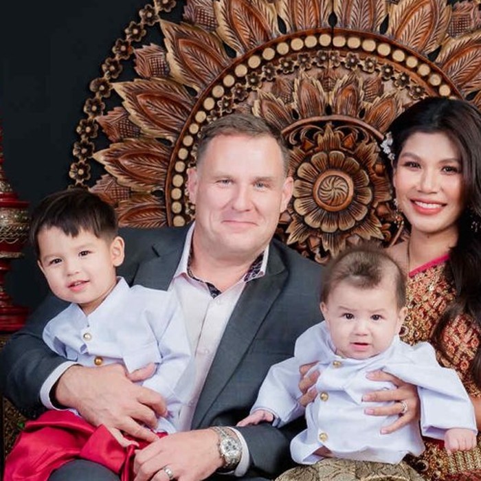 Benjamin Cunningham with his wife Ploy and their sons